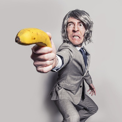 Businessman brandishing a banana