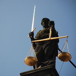 Statue of Lady Justice holding scales and sword