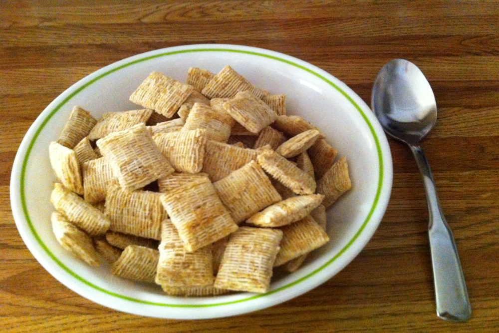 A bowl of shredded wheat cereal
