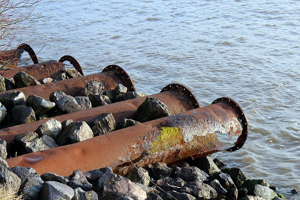 Wastewater pipes leading to a river