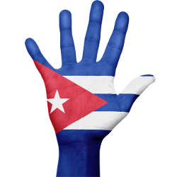 Cuban flag superimposed on an open, raised hand