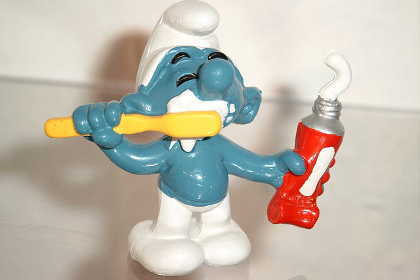 Toy figure brushing its teeth