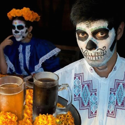 People serving beverages in Day of the Dead dress