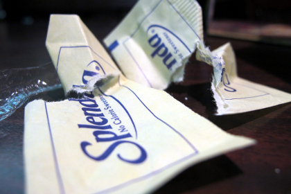 Crumpled packets of Splenda brand artificial sweetener