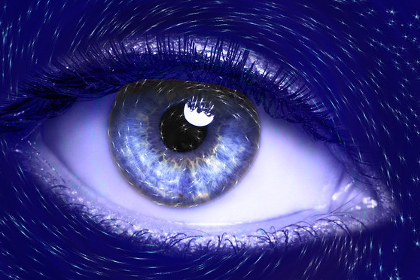 A blue eye surrounded by stars