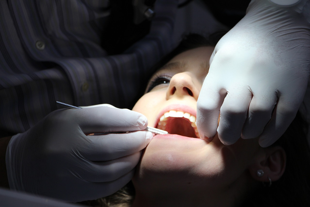 Person getting a dental exam in a dentist's office