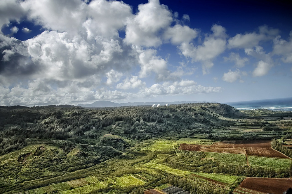 Landscape view of Hawaiian farm fields and mountains