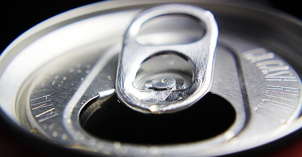 Close up of an open soda pop can lid