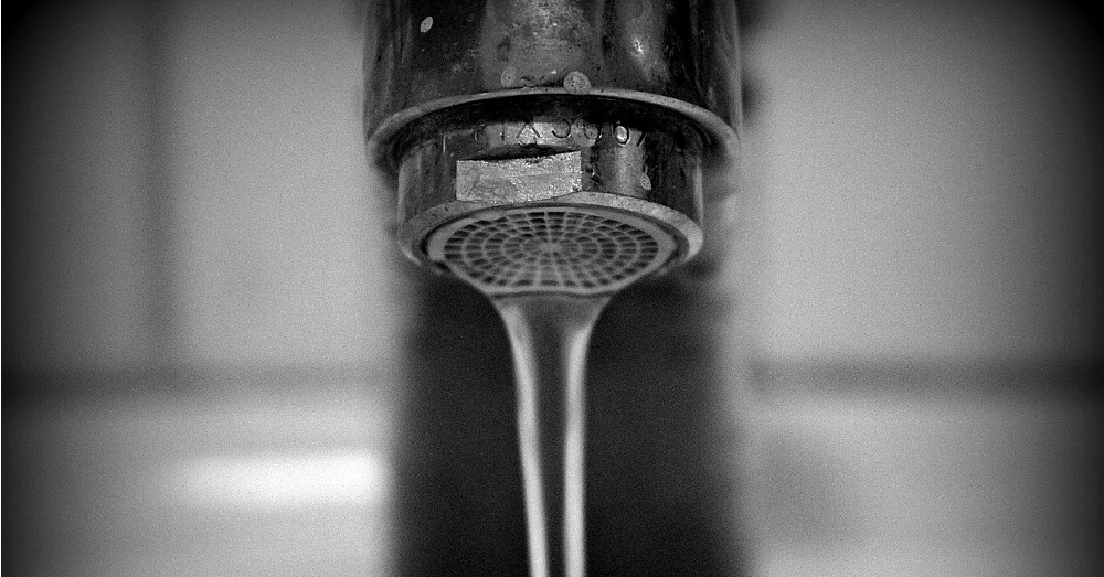 Water dripping out of a faucet