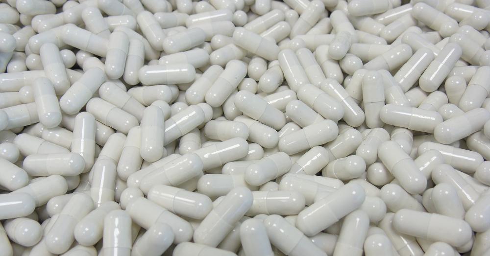 White supplement capsules