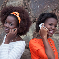 Two girls talking on cell phones