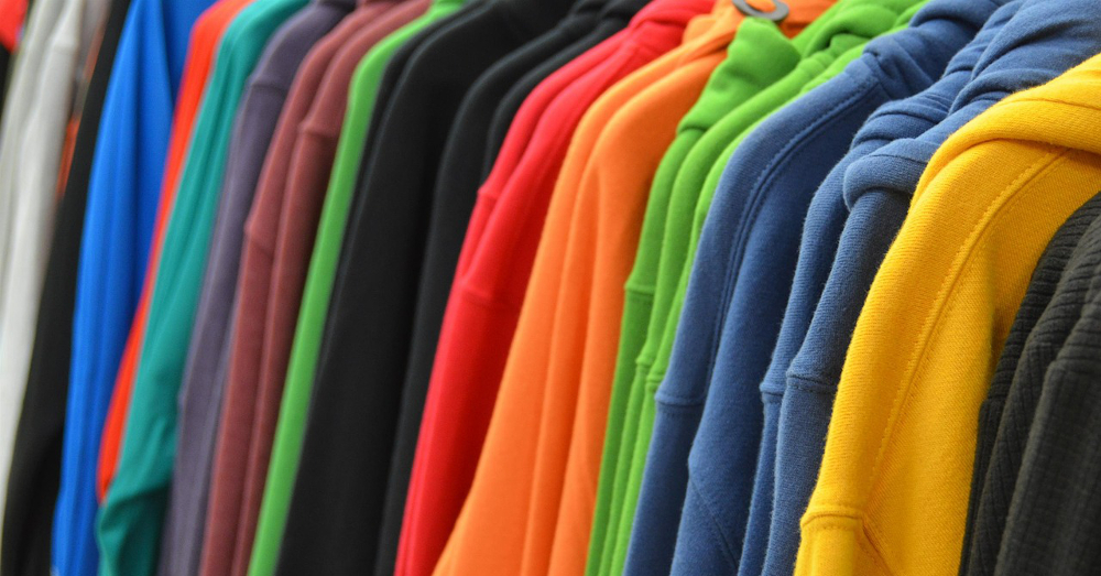 Colorful cotton sweatshirts on a shopping rack