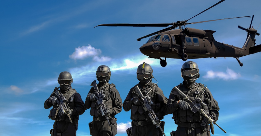 4 army guys with a helicopter flying above