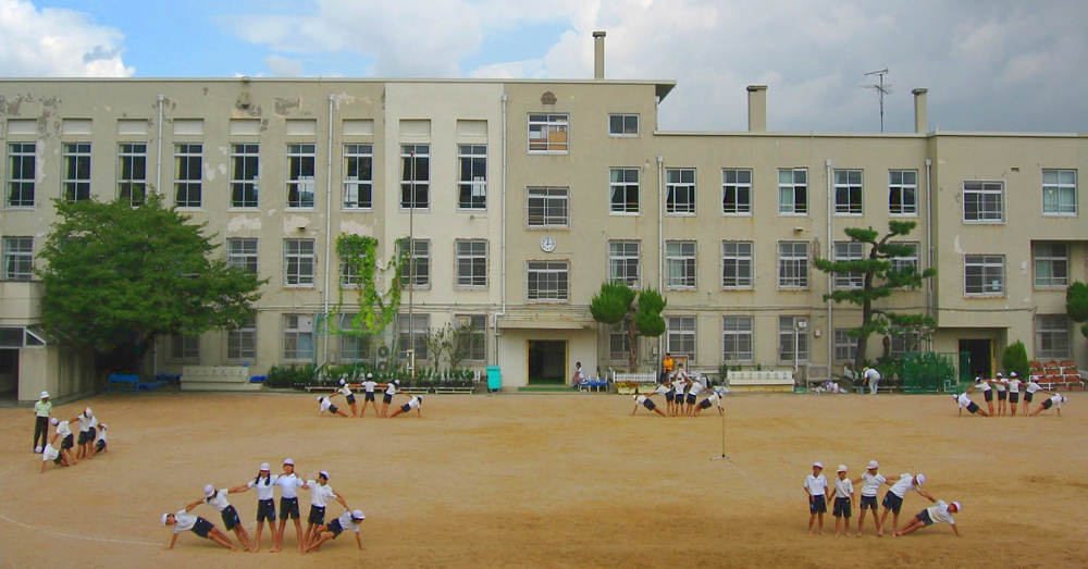 Japanese children participating in group activities during gym class