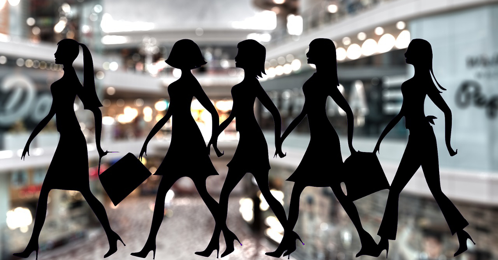 Silhouette of women superimposed on top of an image of a shopping mall