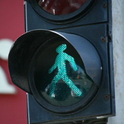 Green traffic light showing pedestrians allowed to walk