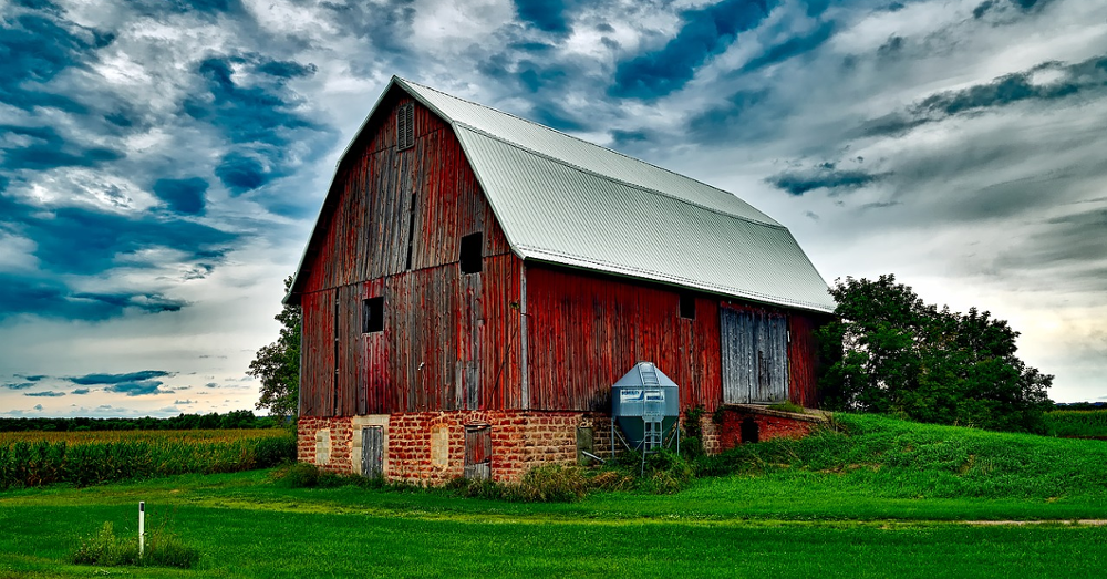 Old red barn under a cloudy sky
