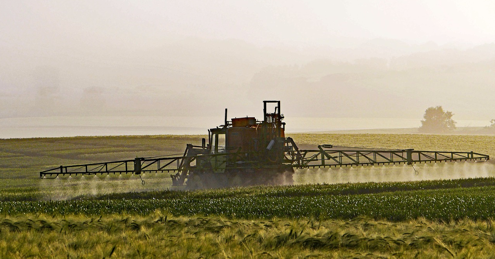 crop sprayer spraying field