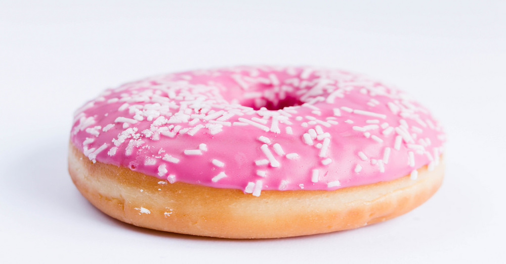 pink doughnut with white sprinkles