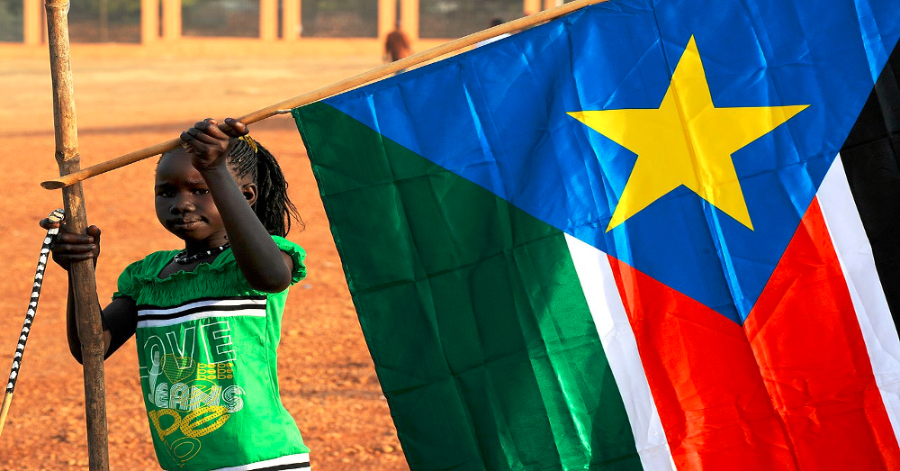 Young girl placing the South Sudan