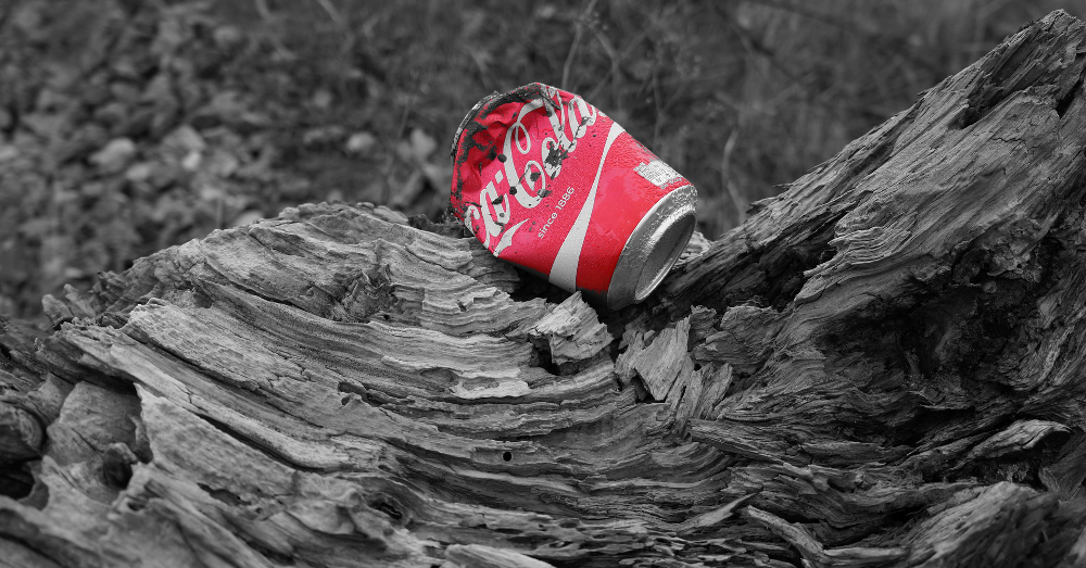 crushed coca cola soda pop can litter