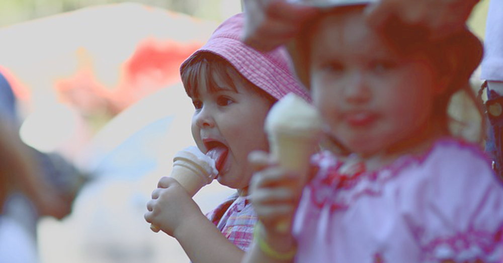 two children eating ice cream cones