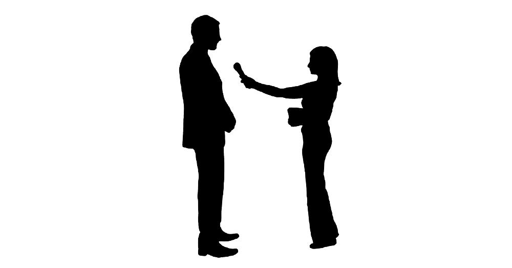 silhouette of a journalist with a microphone interviewing a man