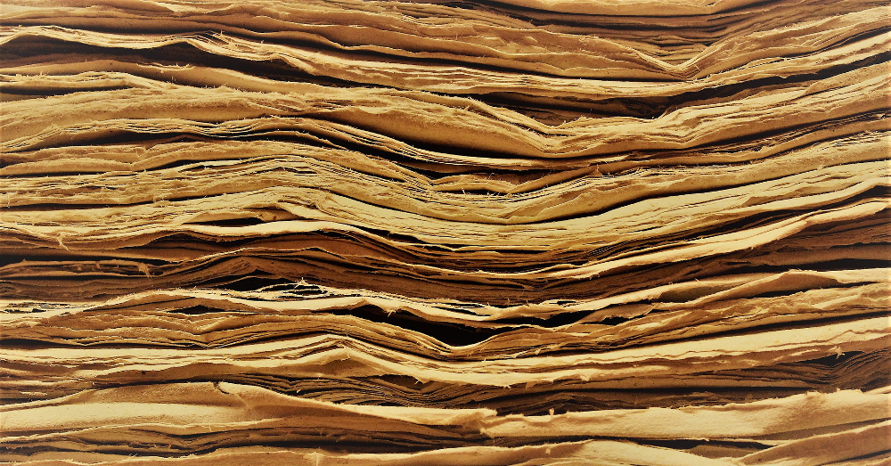 side view of the edges of old worn papers