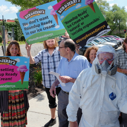 protesters holding signs at a Ben and Jerrys protest march