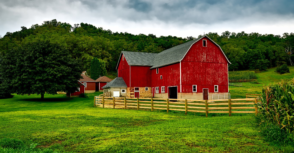 red barn on a farm field in a rural Wisconsin countryside