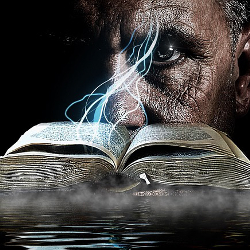 man in front of a smoking book by water