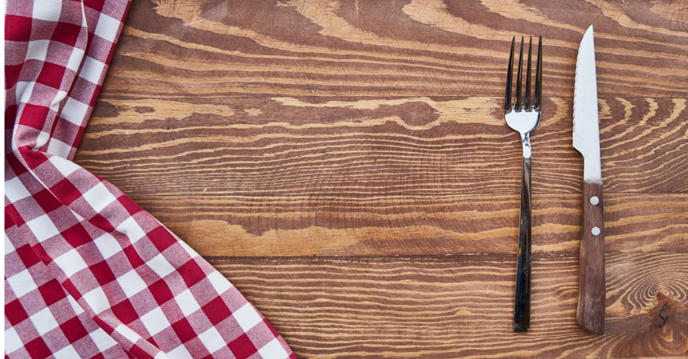 fork and knife on a wooden table