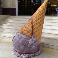 sculpture of an upside down ice cream cone at a mall