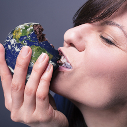 woman eating a cake in the shape of the Earth