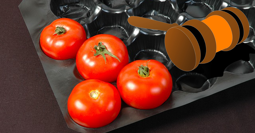 tomatoes in a plastic shipping box with a clipart image of a gavel