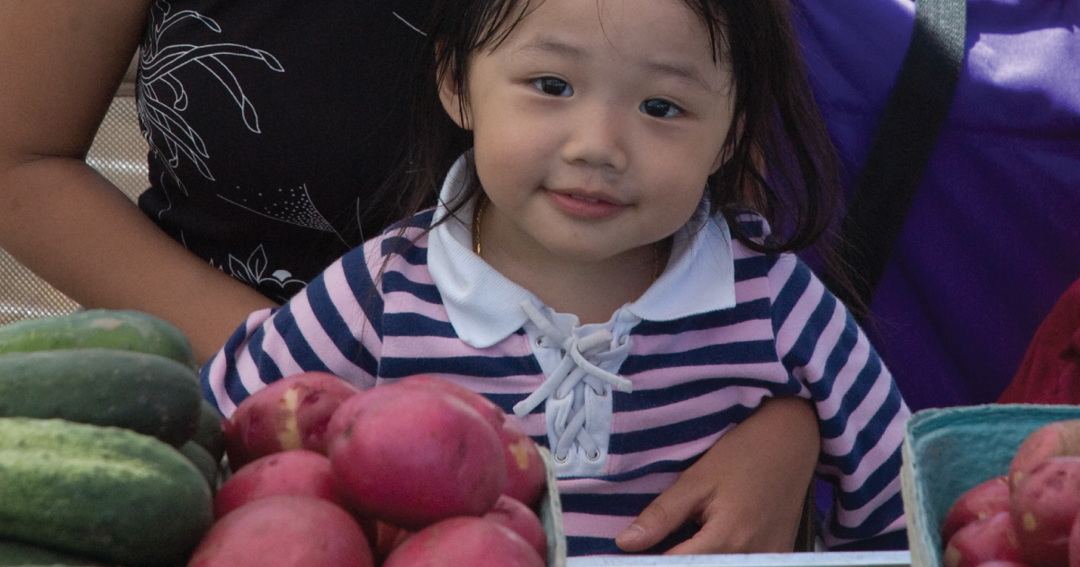 Child at farmers market.