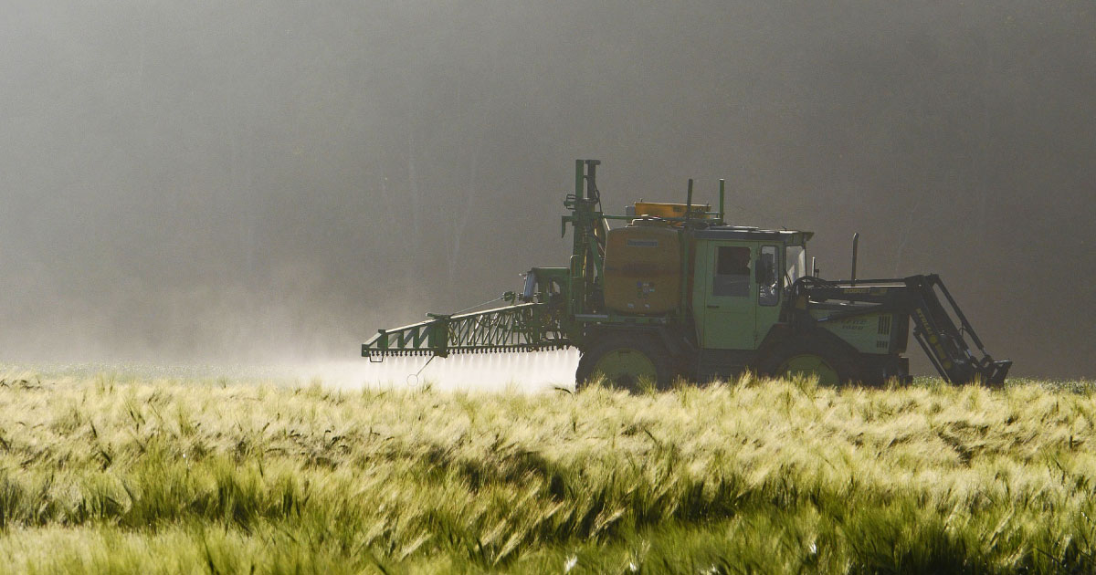 Tractor spraying pesticides.