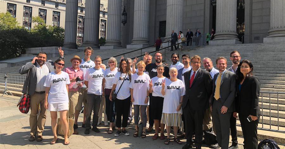 Avaaz members outside courthouse steps