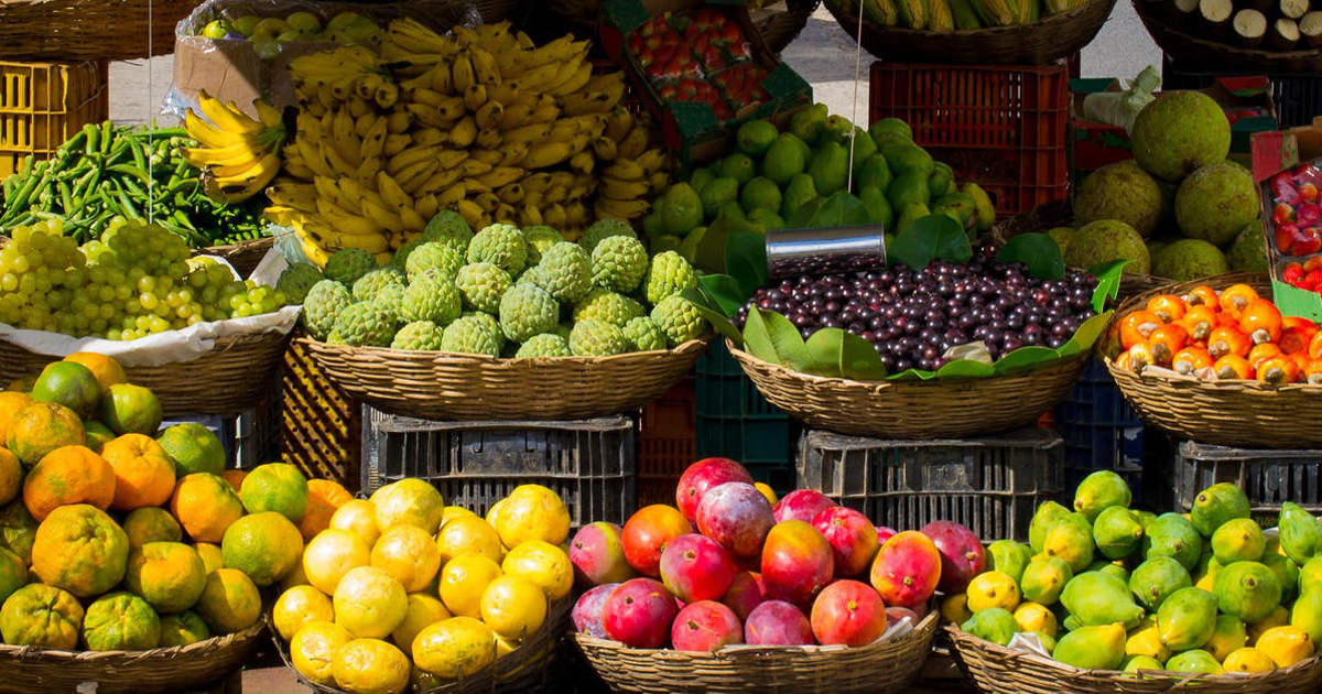 colorful fruit displayed in baskets at a farmers market