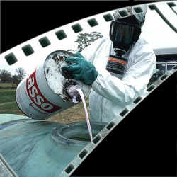 film strip section showing a person in hazmat suit pouring Monsantos Lasso into a tank