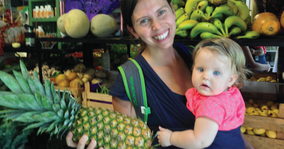 Woman with baby and pineapple