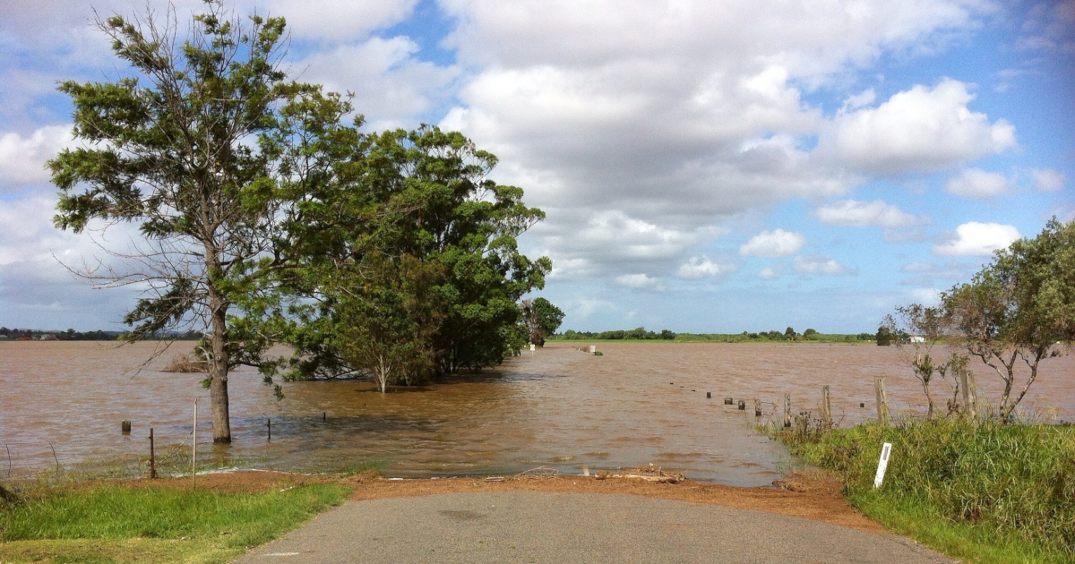 Rural road entering flooded area