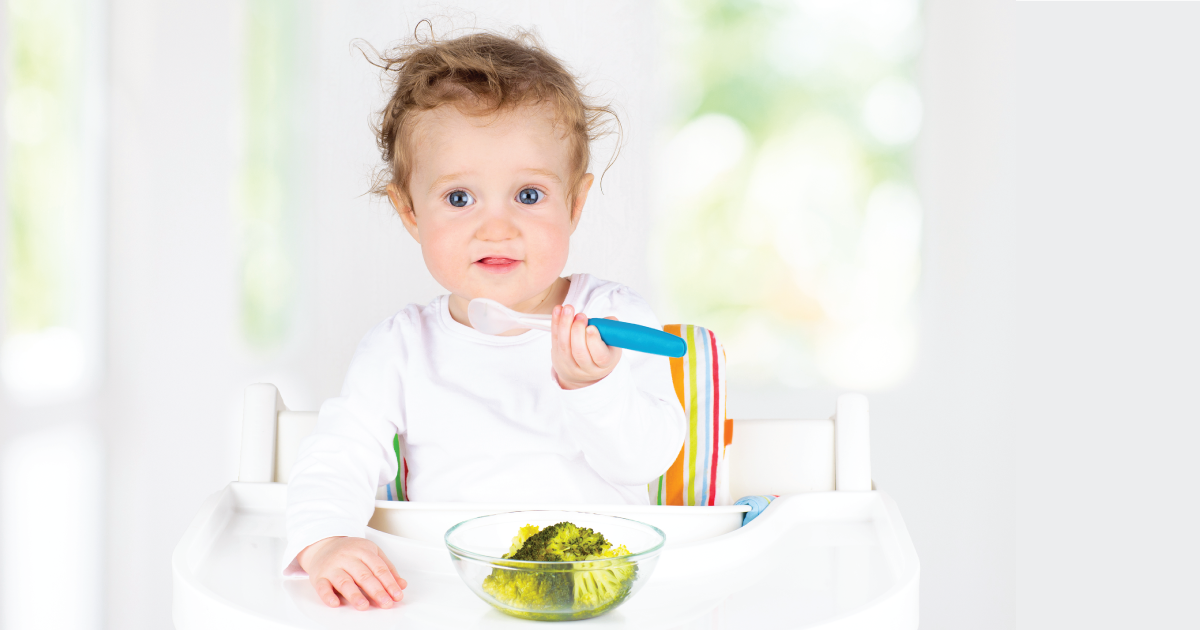 Child eating veggies.