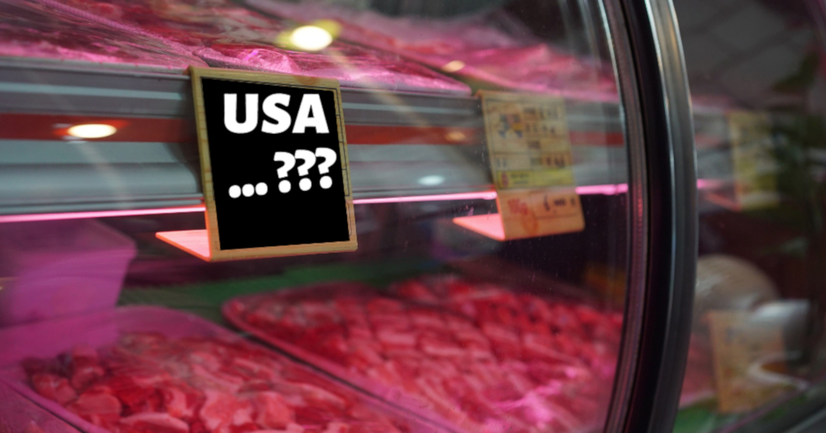 raw meat at a deli counter in a grocery store with a label that questions USA origin