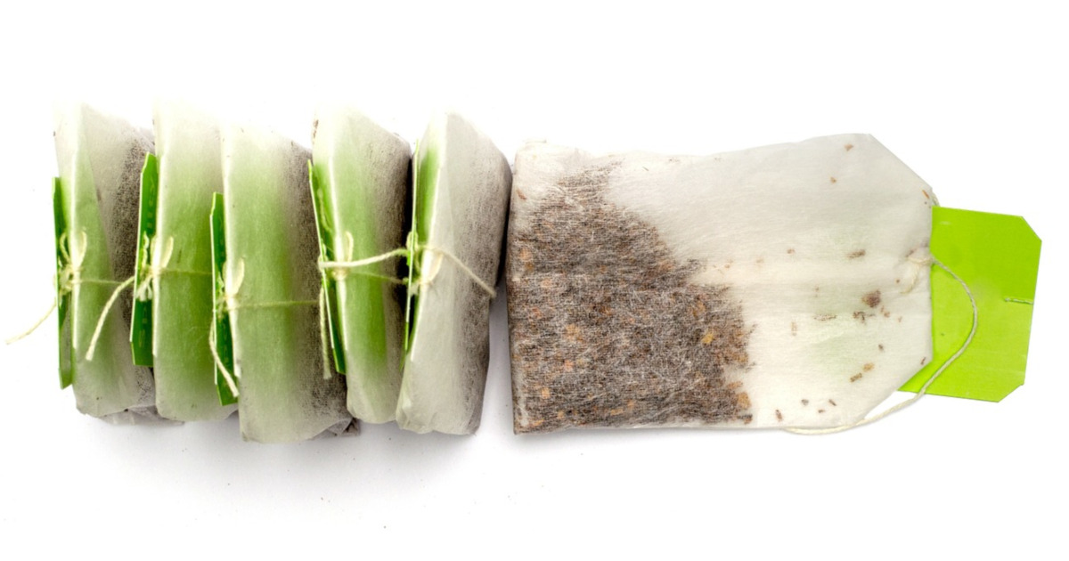 row of tea bags with green tags