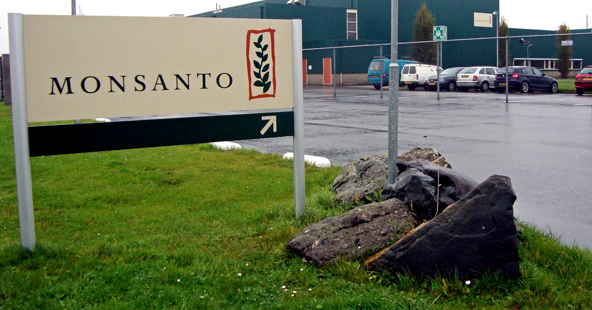 Monsanto sign in the grass outside building