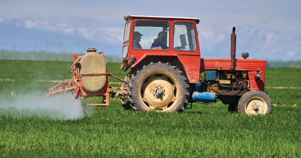 Tractor spraying pesticides.