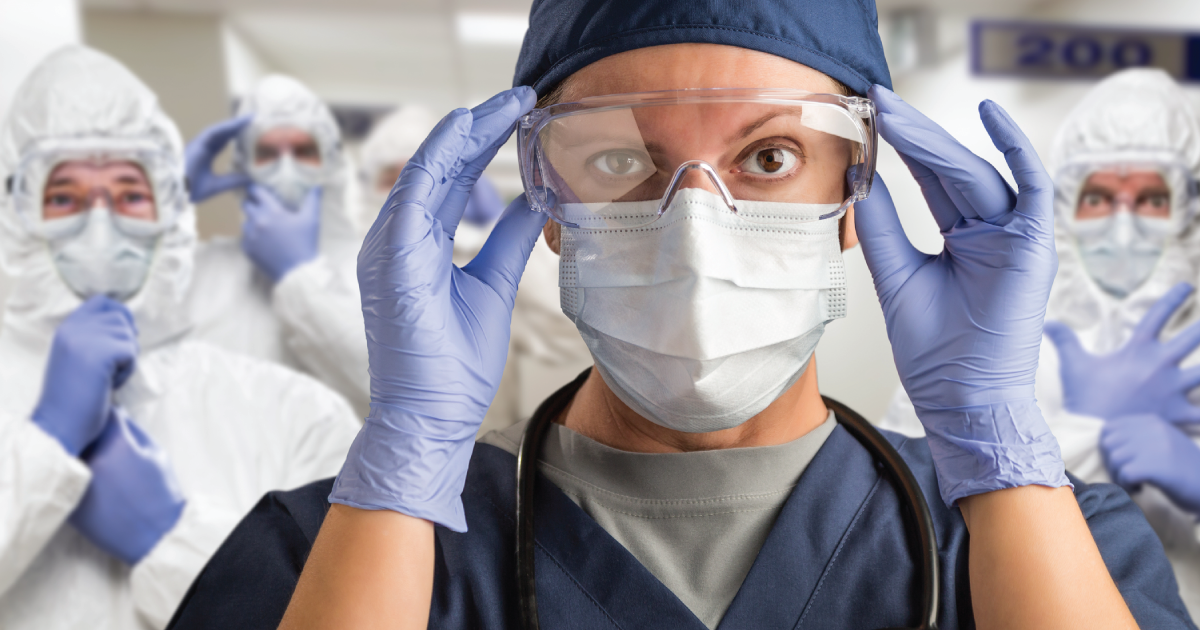 Woman with mask and lab goggles.