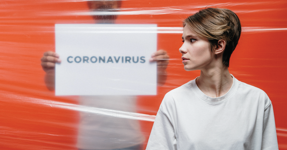 woman with the words 'CORONAVIRUS' behind her.