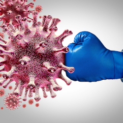 Gloved hand punching a coronavirus image